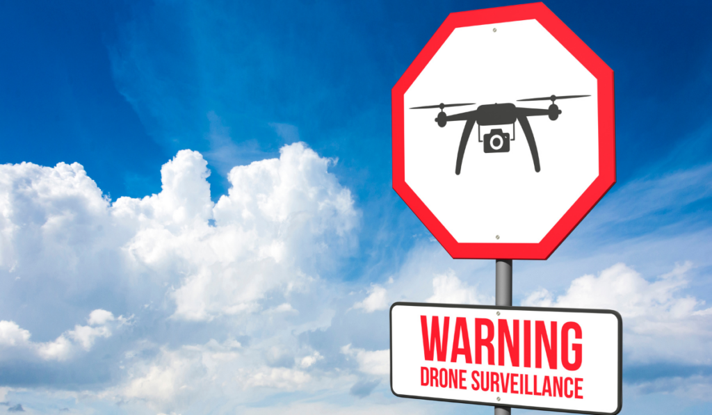 Sign that reads Warning Drone Surveillance