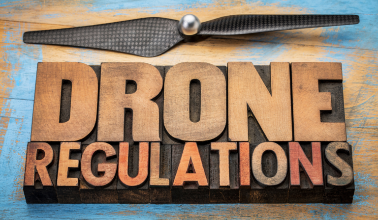 Blocks of carved wooden letters that spell out drone regulations
